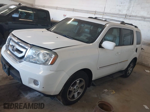 2010 Honda Pilot Touring with VIN 5FNYF4H95AB019903, listed as a IAAI auction lot 42196082 with 233,527 mi miles and . Bid and sale history available at carsss.com. Image 2.