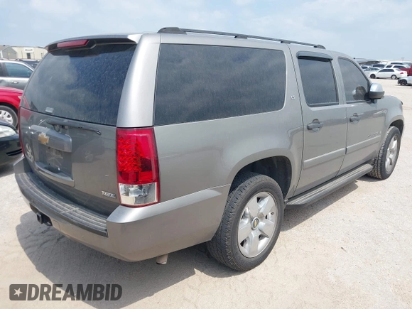 2007 Chevrolet Suburban LS with VIN 1GNFC160X7J233586, listed as a IAAI auction lot 42165186 with 240,183 mi miles and . Bid and sale history available at DreamBid. Image 4.