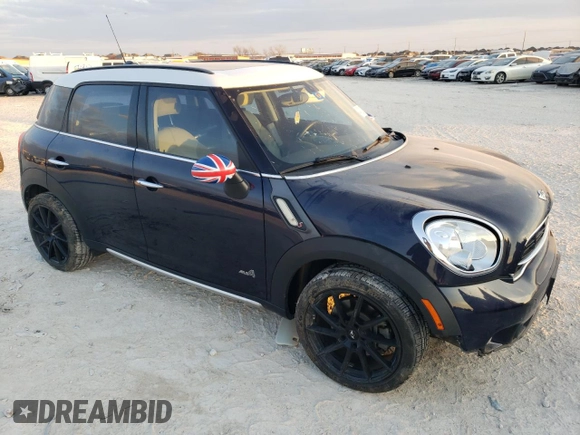 2015 MINI Countryman S with VIN WMWZC5C57FWP48606, listed as a Copart auction lot 47212255 with 104,922 mi miles and Salvage Title. Bid and sale history available at DreamBid. Image 4.