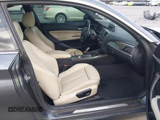 2015 BMW 2 Series 228i with VIN WBA1F5C59FV257447, listed as a IAAI auction lot 41706206 with 119,086 mi miles. Bid and sale history available at carsss.com. Image 5.