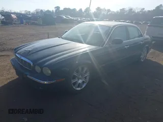 2004 Jaguar XJ with VIN SAJWA71C74SG22814, listed as a IAAI auction lot 41649399 with 114,841 mi miles. Bid and sale history available at carsss.com. Image 2.