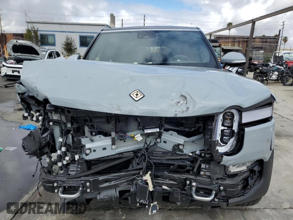 2024 Rivian R1S Adventure with VIN 7PDSGABA7RN038477, listed as a Copart auction lot 48711345 with 0 mi miles and Salvage Title. Bid and sale history available at carsss.com. Image 5.