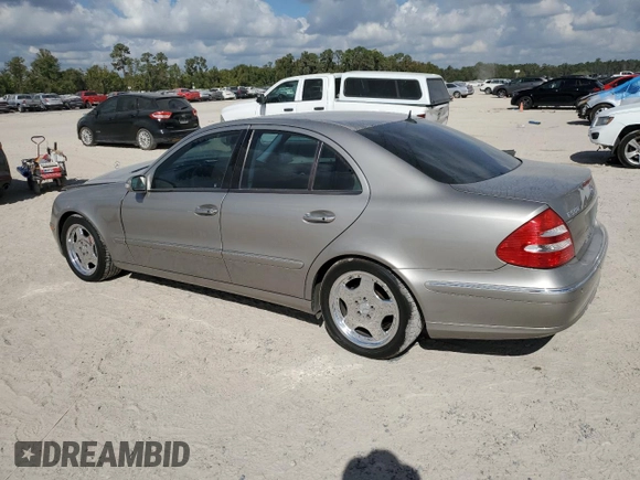 2003 Mercedes-Benz E-Class 5.0L with VIN WDBUF70J73A119596, listed as a Copart auction lot 77382424 with 237,620 mi miles and Salvage Title. Bid and sale history available at carsss.com. Image 2.