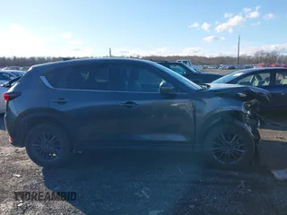 2021 Mazda CX-5 Touring with VIN JM3KFBCM8M1370640, listed as a IAAI auction lot 41207736 with 57,570 mi miles. Bid and sale history available at carsss.com. Image 14.
