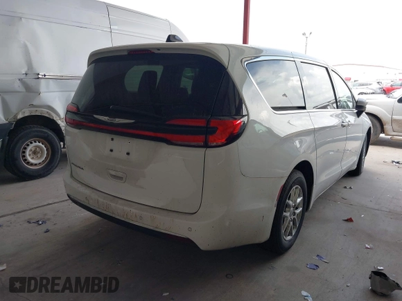 2023 Chrysler Pacifica Touring L with VIN 2C4RC1BG6PR550575, listed as a IAAI auction lot 42576498 with 54,373 mi miles and . Bid and sale history available at DreamBid. Image 4.