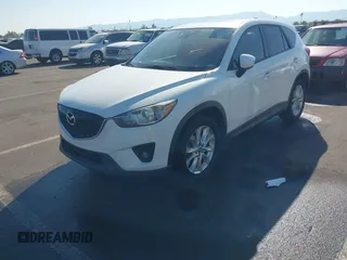 2014 Mazda CX-5 Grand Touring with VIN JM3KE4DY4E0375809, listed as a IAAI auction lot 41468078 with 151,226 mi miles. Bid and sale history available at carsss.com. Image 2.