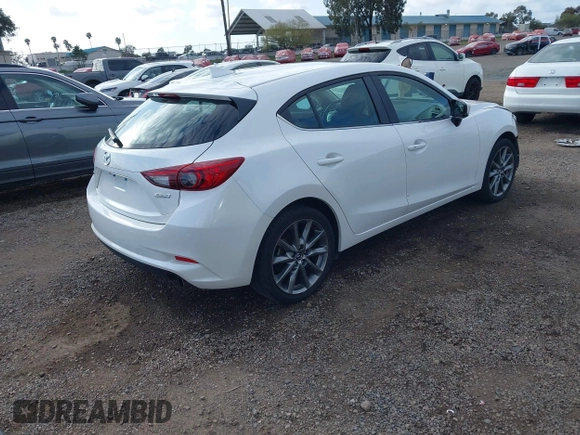 2018 Mazda 3 Touring with VIN 3MZBN1L31JM225108, listed as a IAAI auction lot 41959304 with 74,933 mi miles. Bid and sale history available at carsss.com. Image 4.