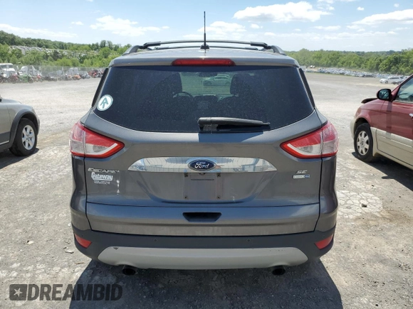 2014 Ford Escape SE с VIN 1FMCU9G90EUC19255, выставлен на аукционе Copart как лот 57267775 с пробегом 102 924 миль миль и Списание • Salvage title. История ставок и продаж доступна на DreamBid. Изображение 6.