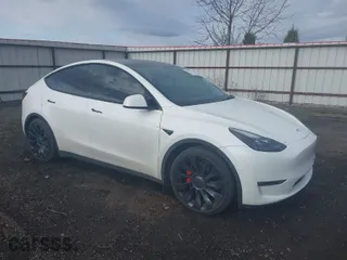 2021 Tesla Model Y Performance with VIN 5YJYGDEF1MF244556, listed as a IAAI auction lot 41921393 with 77,443 mi miles. Bid and sale history available at carsss.com. Image 1.