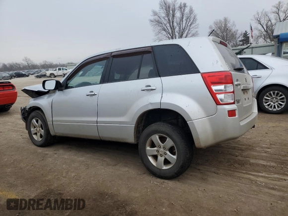 2012 Suzuki Grand Vitara Premium z VIN JS3TD0D66C4100621, wystawiony jako Copart lot #86968164 z przebiegiem Nie podano mil oraz Szkody całkowita. Historia ofert i sprzedaży dostępna na DreamBid. Obrazek 2.