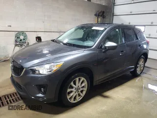 2015 Mazda CX-5 Grand Touring with VIN JM3KE4DY1F0454713, listed as a Copart auction lot 48548285 with 132,454 mi miles and Salvage Title. Bid and sale history available at carsss.com. Image 1.
