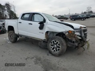 2022 GMC Canyon 4WD AT4 w/Cloth with VIN 1GTG6FEN5N1155598, listed as a Copart auction lot 41970495 with 57,572 mi miles and Salvage Title. Bid and sale history available at carsss.com. Image 4.