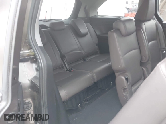 2018 Honda Odyssey Touring with VIN 5FNRL6H89JB057148, listed as a IAAI auction lot 42511909 with 166,438 mi miles and . Bid and sale history available at DreamBid. Image 8.