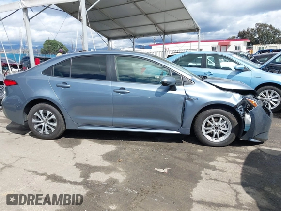 2021 Toyota Corolla Hybrid LE with VIN JTDEAMDE0MJ026601, listed as a IAAI auction lot 41797452 with 85,294 mi miles. Bid and sale history available at carsss.com. Image 13.