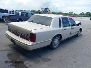 1996 Lincoln Town Car Cartier with VIN 1LNLM83W7TY634343, listed as a IAAI auction lot 42474123 with 193,705 mi miles and . Bid and sale history available at DreamBid. Image 4.