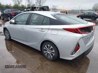 2021 Toyota Prius LE with VIN JTDKAMFP9M3170928, listed as a IAAI auction lot 42123934 with 58,293 mi miles and . Bid and sale history available at DreamBid. Image 3.