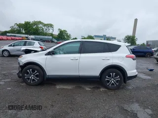 2018 Toyota RAV4 LE with VIN 2T3BFREV7JW851015, listed as a IAAI auction lot 42354042 with 94,603 mi miles and . Bid and sale history available at DreamBid. Image 14.