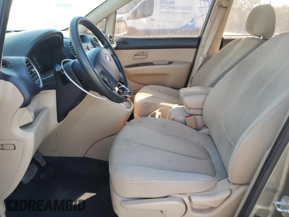2009 Kia Rondo LX with VIN KNAFG528497221625, listed as a Copart auction lot 75915694 with 245,165 mi miles and Salvage Title. Bid and sale history available at carsss.com. Image 7.