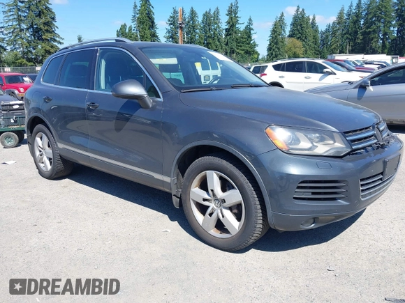 2012 Volkswagen Touareg Sport with VIN WVGFK9BP0CD004951, listed as a IAAI auction lot 42724125 with 173,993 mi miles and . Bid and sale history available at DreamBid. Image 1.
