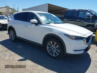 2019 Mazda CX-5 Grand Touring with VIN JM3KFADMXK0517911, listed as a IAAI auction lot 42537738 with 49,936 mi miles and . Bid and sale history available at DreamBid. Image 1.