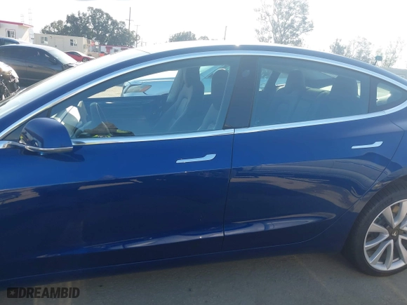 2019 Tesla Model 3 Long Range with VIN 5YJ3E1EB3KF497841, listed as a IAAI auction lot 41969728 with 21,127 mi miles. Bid and sale history available at carsss.com. Image 15.