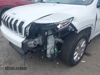 2016 Jeep Cherokee Latitude z VIN 1C4PJMCB3GW237461, wystawiony jako IAAI lot #42495278 z przebiegiem 102 417 mil mil oraz . Historia ofert i sprzedaży dostępna na DreamBid. Obrazek 6.
