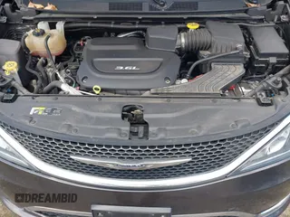 2017 Chrysler Pacifica Touring L with VIN 2C4RC1BGXHR667397, listed as a IAAI auction lot 42085117 with 63,996 mi miles and . Bid and sale history available at DreamBid. Image 10.