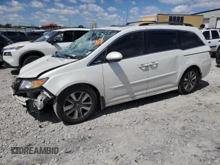 2014 Honda Odyssey Touring with VIN 5FNRL5H98EB053486, listed as a Copart auction lot 58004225 with 201,526 mi miles and Salvage title. Bid and sale history available at DreamBid. Image 1.