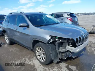 2015 Jeep Cherokee Latitude with VIN 1C4PJLCB8FW620336, listed as a IAAI auction lot 41634997 with 130,335 mi miles. Bid and sale history available at carsss.com. Image 1.