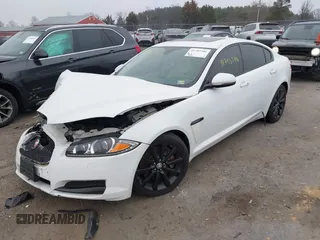 2014 Jaguar XF SC with VIN SAJWA0EX0E8U09381, listed as a IAAI auction lot 41783386 with 27,730 mi miles and . Bid and sale history available at DreamBid. Image 2.