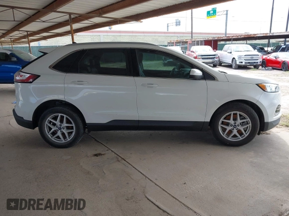 2021 Ford Edge SEL z VIN 2FMPK3J98MBA32220, wystawiony jako IAAI lot #41945825 z przebiegiem Nie podano mil oraz . Historia ofert i sprzedaży dostępna na DreamBid. Obrazek 13.