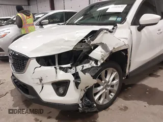 2014 Mazda CX-5 Grand Touring with VIN JM3KE4DY3E0374036, listed as a IAAI auction lot 41889030 with 162,611 mi miles and . Bid and sale history available at DreamBid. Image 6.