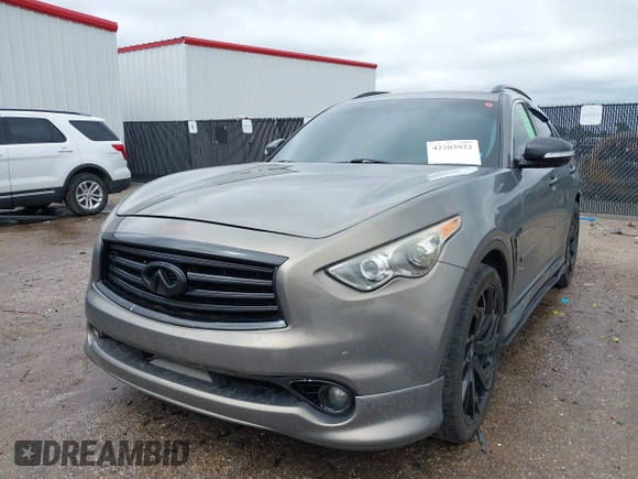 2014 Infiniti QX70 z VIN JN8CS1MU3EM451745, wystawiony jako IAAI lot #42203922 z przebiegiem 144 990 mil mil oraz . Historia ofert i sprzedaży dostępna na DreamBid. Obrazek 17.