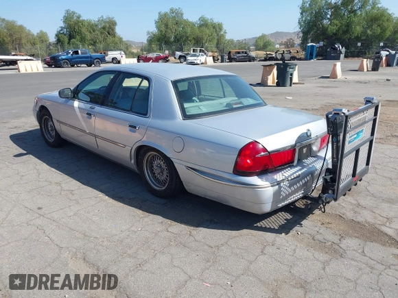 2002 Mercury Grand Marquis LS Premium z VIN 2MEFM75W82X653148, wystawiony jako IAAI lot #42307985 z przebiegiem 92 233 mil mil oraz . Historia ofert i sprzedaży dostępna na DreamBid. Obrazek 3.
