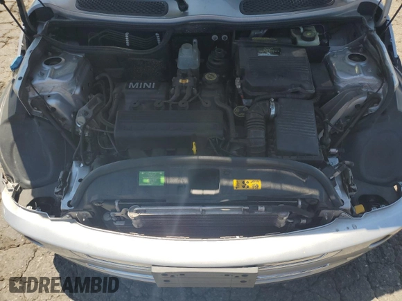 2006 MINI Convertible with VIN WMWRF33576TG16056, listed as a Copart auction lot 63127705 with 108,654 mi miles and Salvage title. Bid and sale history available at DreamBid. Image 11.