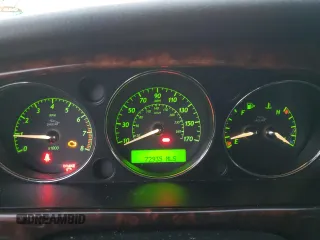 2004 Jaguar XJ with VIN SAJEA71C54SG01326, listed as a Copart auction lot 77449324 with 72,935 mi miles and Salvage Title. Bid and sale history available at carsss.com. Image 9.