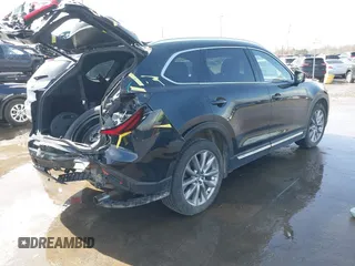2020 Mazda CX-9 Grand Touring with VIN JM3TCBDY2L0413839, listed as a IAAI auction lot 41720713 with 48,964 mi miles and . Bid and sale history available at DreamBid. Image 4.