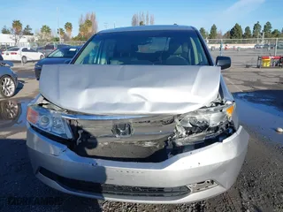 2011 Honda Odyssey EX-L with VIN 5FNRL5H6XBB057556, listed as a IAAI auction lot 41808620 with 154,449 mi miles. Bid and sale history available at carsss.com. Image 12.