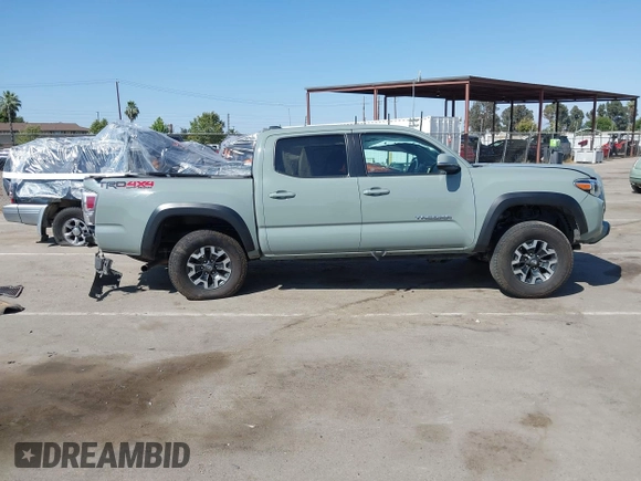 2022 Toyota Tacoma SR with VIN 3TMCZ5AN0NM489420, listed as a IAAI auction lot 42597175 with 129,340 mi miles and . Bid and sale history available at DreamBid. Image 14.