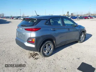 2021 Hyundai Kona SE with VIN KM8K12AA9MU667653, listed as a IAAI auction lot 41889973 with 30,399 mi miles and . Bid and sale history available at DreamBid. Image 4.