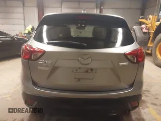 2014 Mazda CX-5 Grand Touring with VIN JM3KE4DY5E0305882, listed as a IAAI auction lot 41879532 with 173,443 mi miles. Bid and sale history available at carsss.com. Image 16.