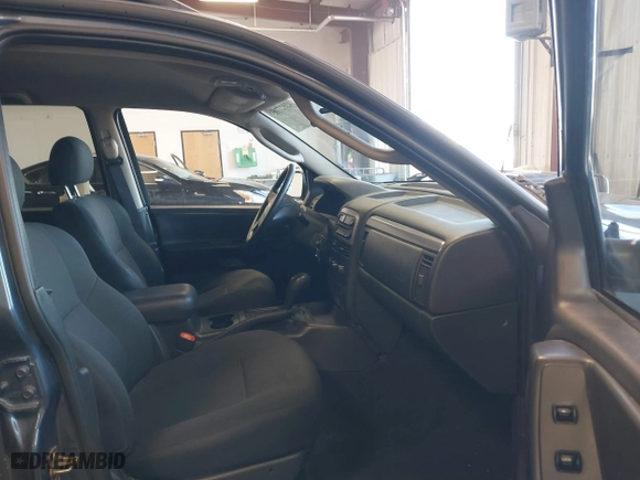 2003 Jeep Grand Cherokee Laredo with VIN 1J4GW48S33C539977, listed as a IAAI auction lot 42027703 with 100,534 mi miles. Bid and sale history available at carsss.com. Image 5.