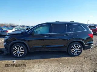 2016 Honda Pilot Elite with VIN 5FNYF6H01GB050524, listed as a IAAI auction lot 41452563 with 140,326 mi miles. Bid and sale history available at carsss.com. Image 14.