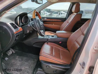 2012 Jeep Grand Cherokee Overland with VIN 1C4RJFCG9CC199486, listed as a Copart auction lot 51942135 with 113,098 mi miles and Salvage Title. Bid and sale history available at carsss.com. Image 7.