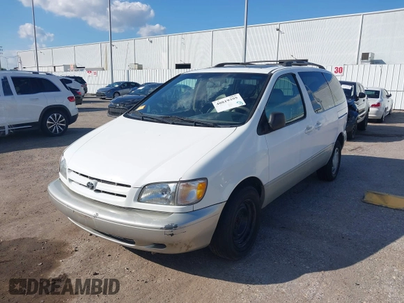 1999 Toyota Sienna LE with VIN 4T3ZF13C1XU152733, listed as a IAAI auction lot 40819395 with 184,540 mi miles. Bid and sale history available at carsss.com. Image 2.
