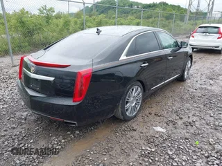 2014 Cadillac XTS Luxury with VIN 2G61M5S32E9231544, listed as a IAAI auction lot 42340088 with 74,518 mi miles and . Bid and sale history available at DreamBid. Image 4.