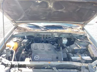 2005 Mazda Tribute S with VIN 4F2CZ96105KM04032, listed as a IAAI auction lot 42157429 with 199,704 mi miles and . Bid and sale history available at carsss.com. Image 10.