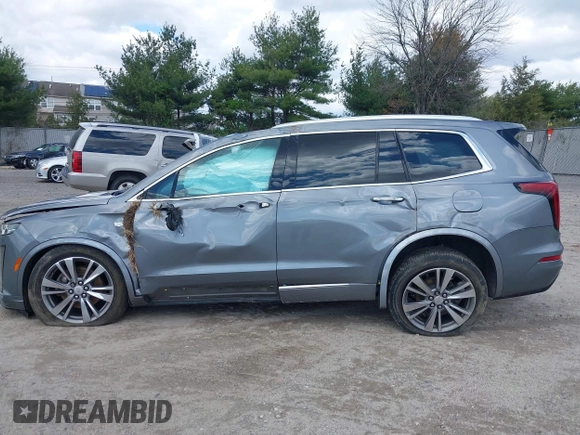 2020 Cadillac XT6 FWD Premium Luxury z VIN 1GYKPCRS9LZ129763, wystawiony jako IAAI lot #42052532 z przebiegiem 57 670 mil mil oraz . Historia ofert i sprzedaży dostępna na DreamBid. Obrazek 13.