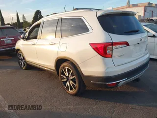 2019 Honda Pilot Touring 8-Passenger with VIN 5FNYF5H97KB005203, listed as a IAAI auction lot 41399930 with 47,267 mi miles and . Bid and sale history available at DreamBid. Image 3.