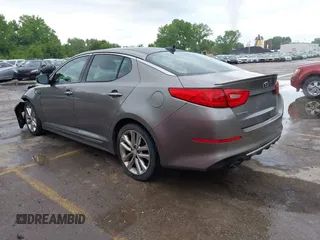 2014 Kia Optima SXL Turbo with VIN 5XXGR4A68EG303094, listed as a IAAI auction lot 42207175 with 105,521 mi miles and . Bid and sale history available at DreamBid. Image 3.